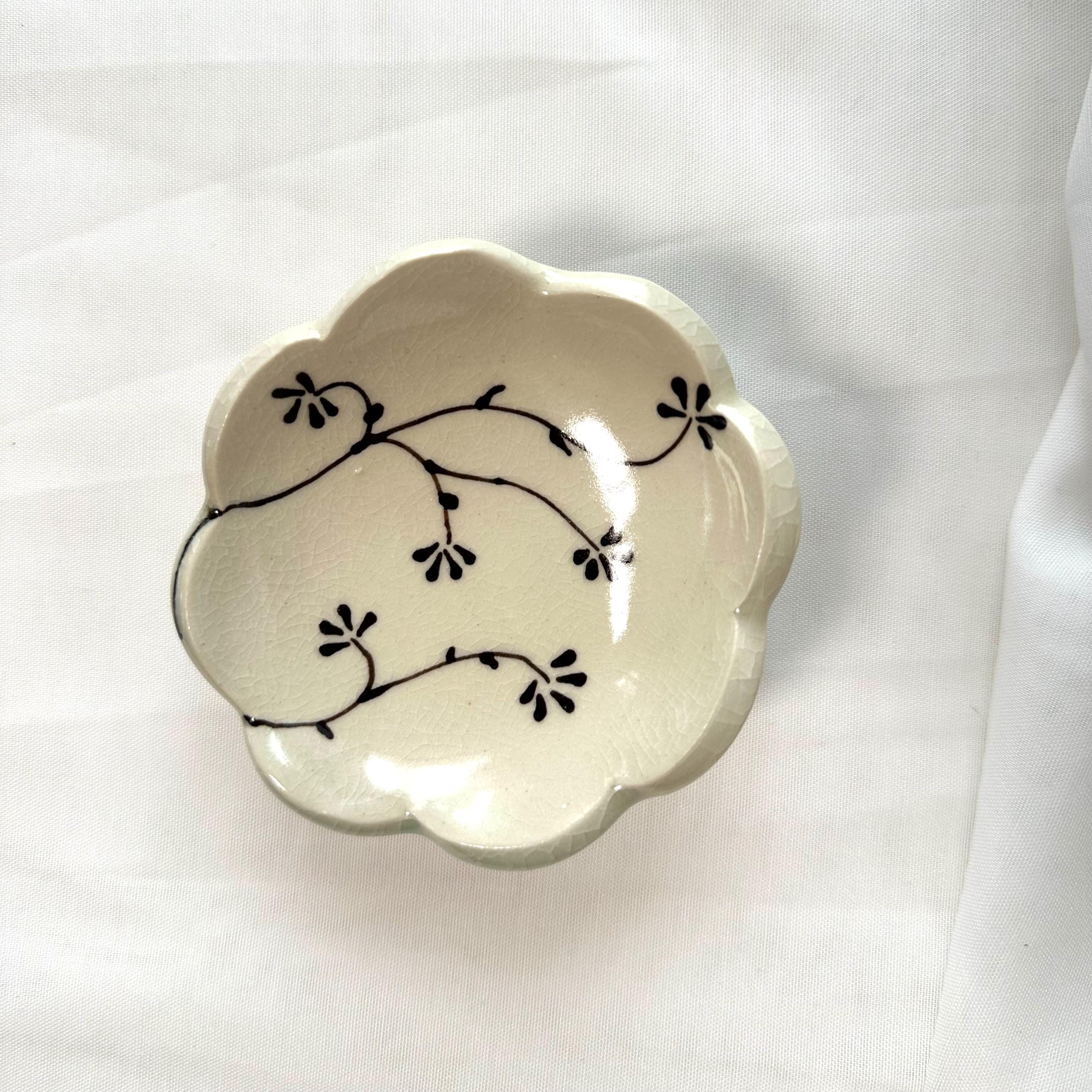 Handmade and hand painted pottery footed dish, with handpainted brown underglaze and finished in a clear glaze, 4”