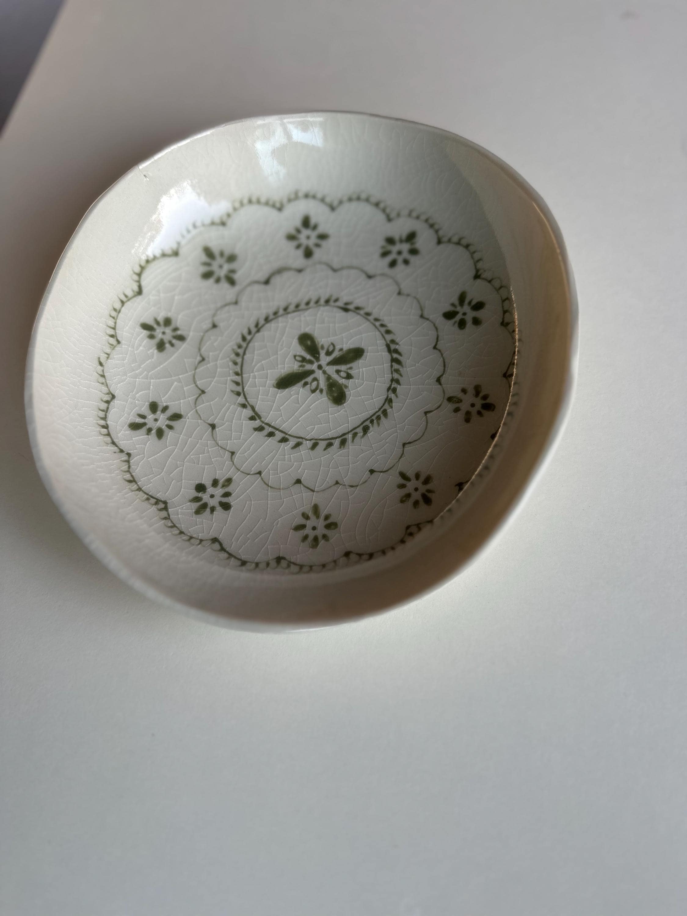 Handmade and hand painted pottery bowl,  with handpainted green underglaze and finished in a clear glaze, 7”