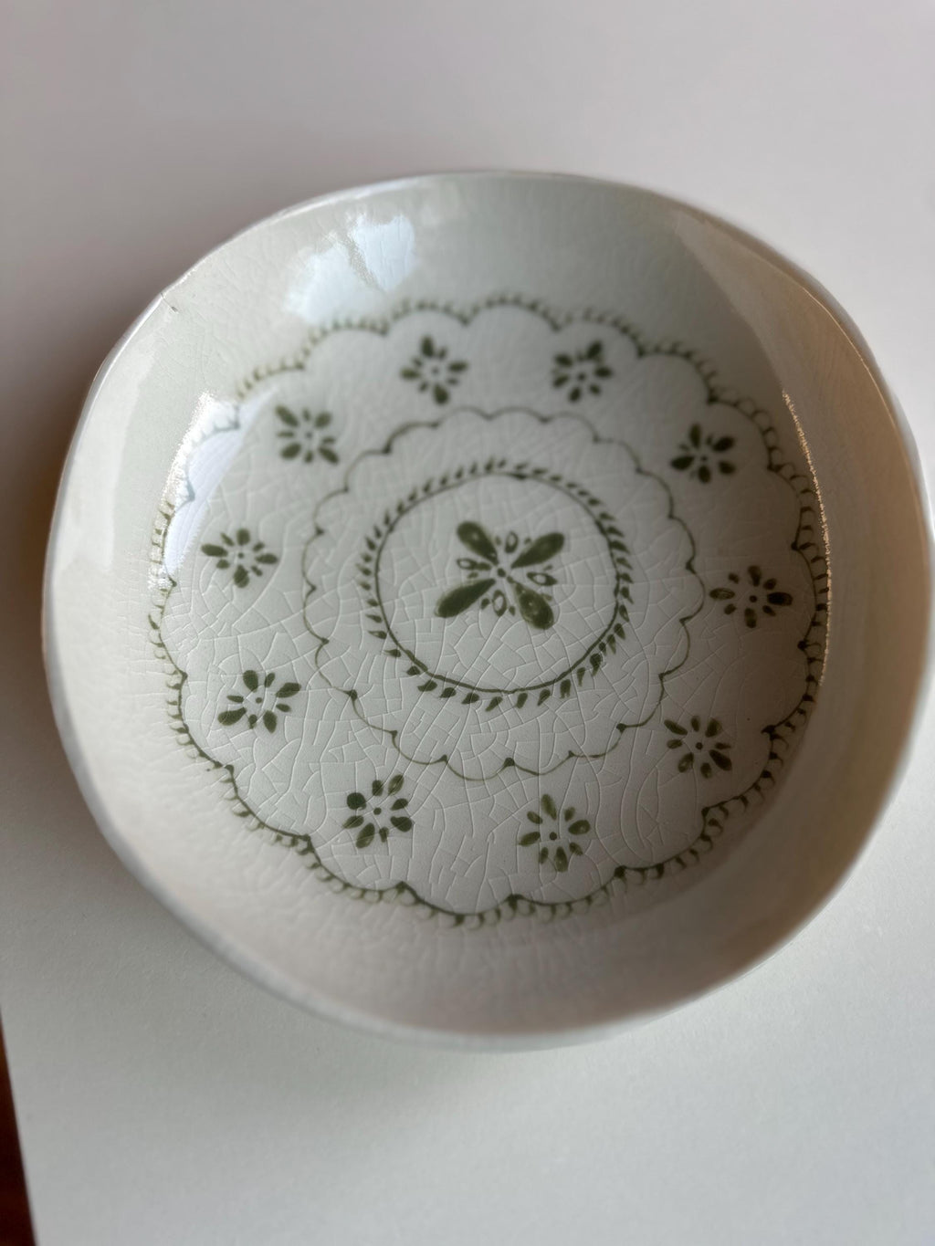 Handmade and hand painted pottery bowl,  with handpainted green underglaze and finished in a clear glaze, 7”