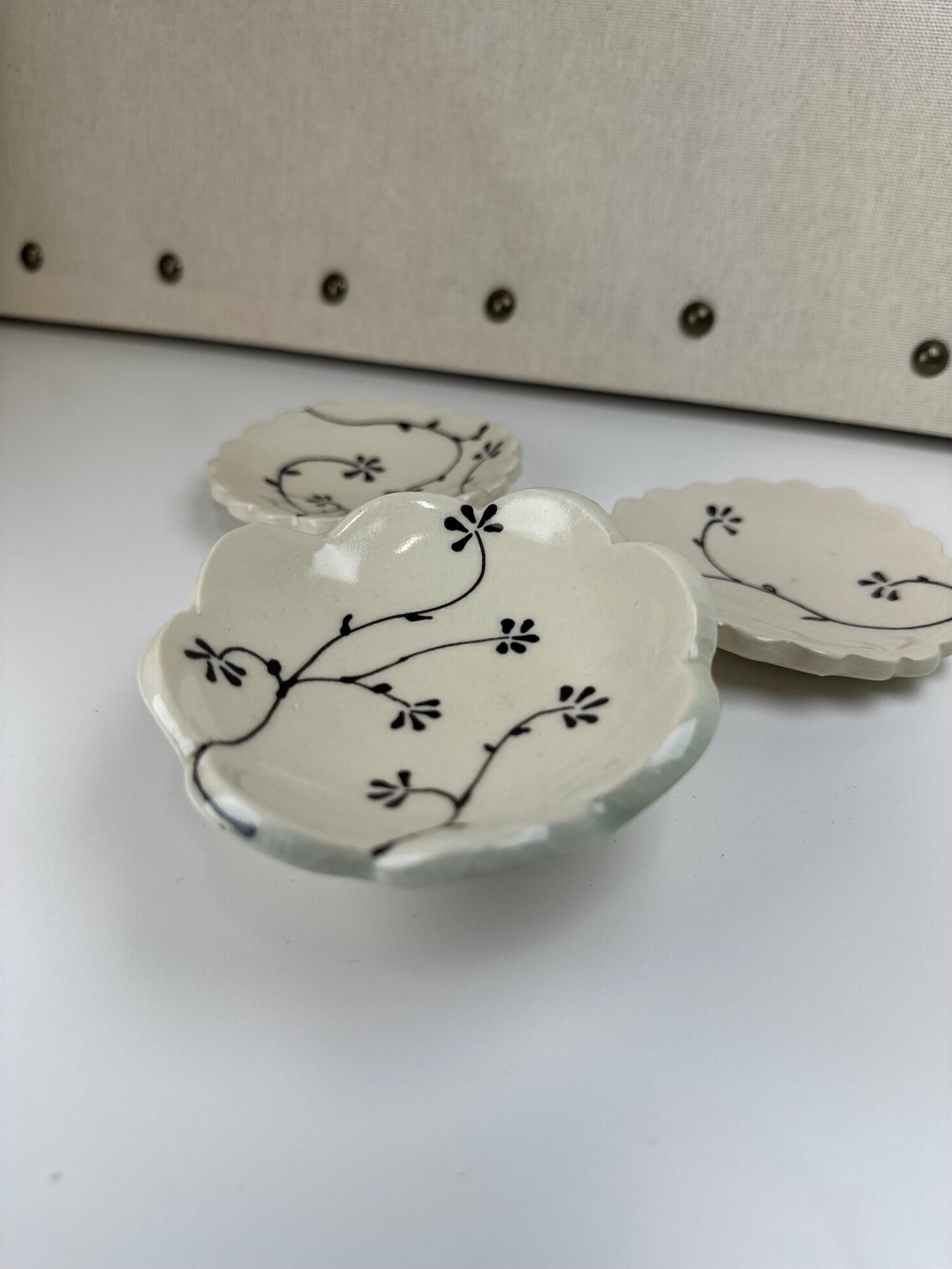 Handmade and hand painted pottery footed dish, with handpainted brown underglaze and finished in a clear glaze, 4”