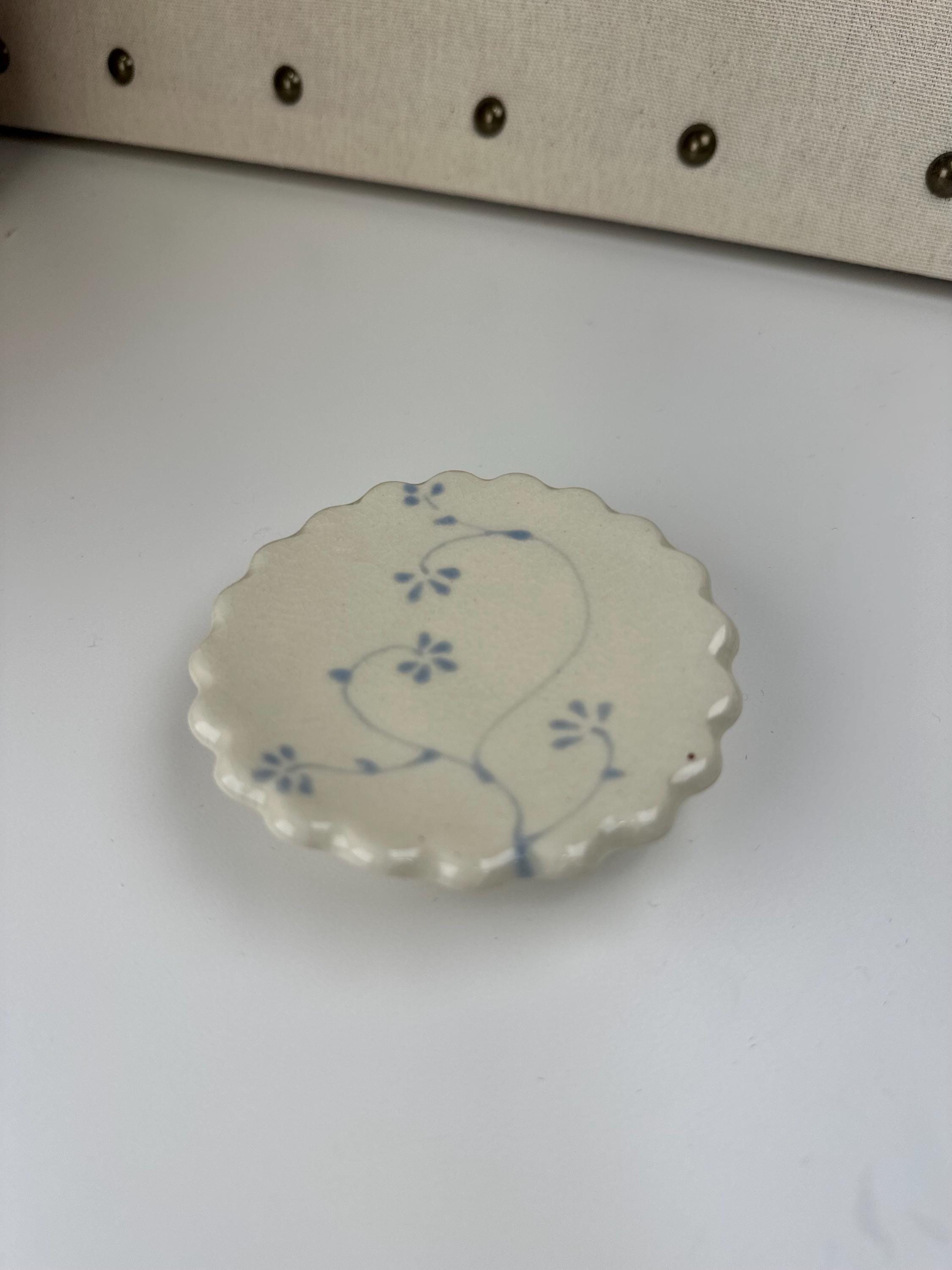Handmade and hand painted pottery trinket dish, with handpainted blue underglaze and finished in a clear glaze, 3” with foot