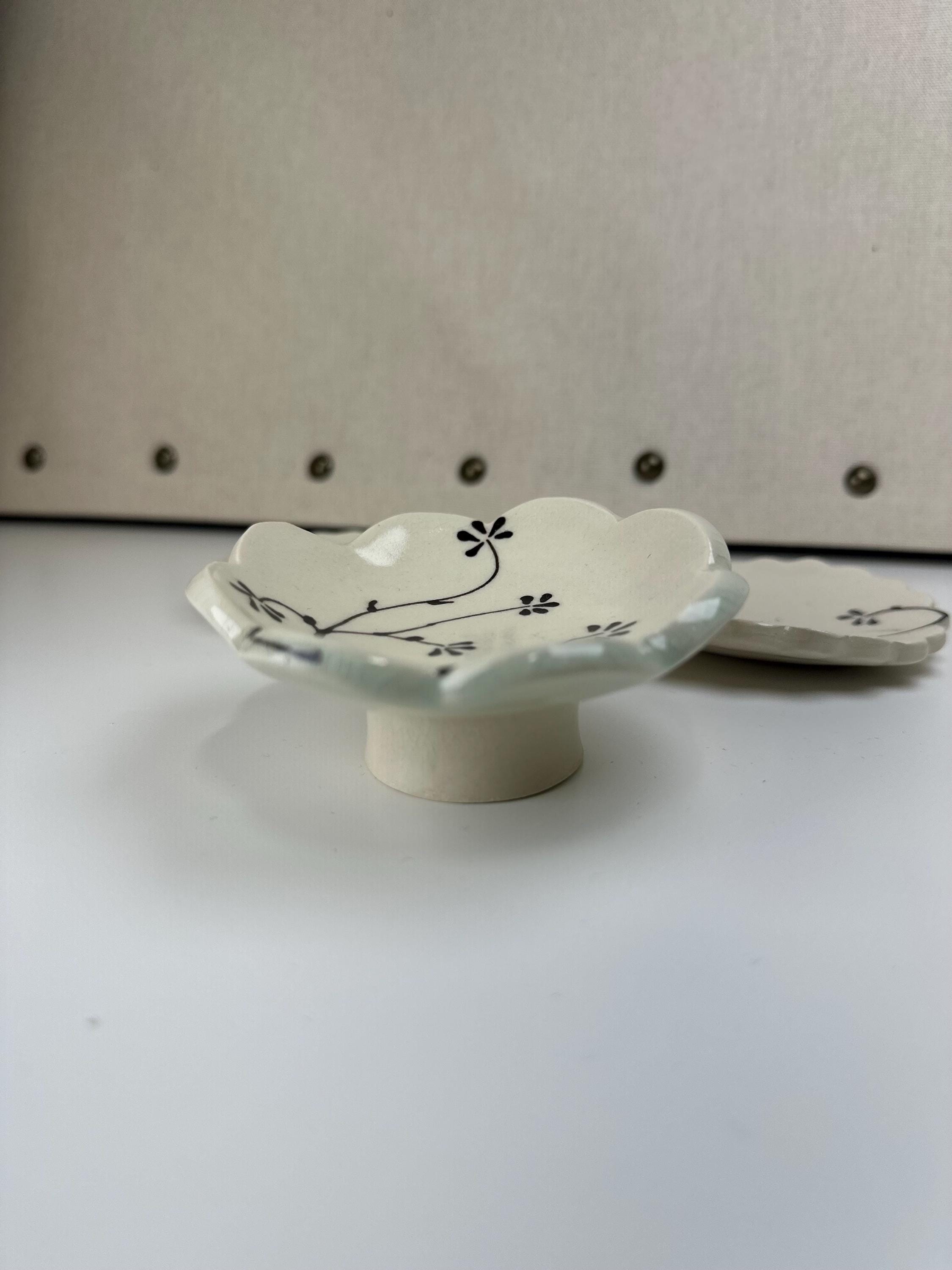 Handmade and hand painted pottery footed dish, with handpainted brown underglaze and finished in a clear glaze, 4”