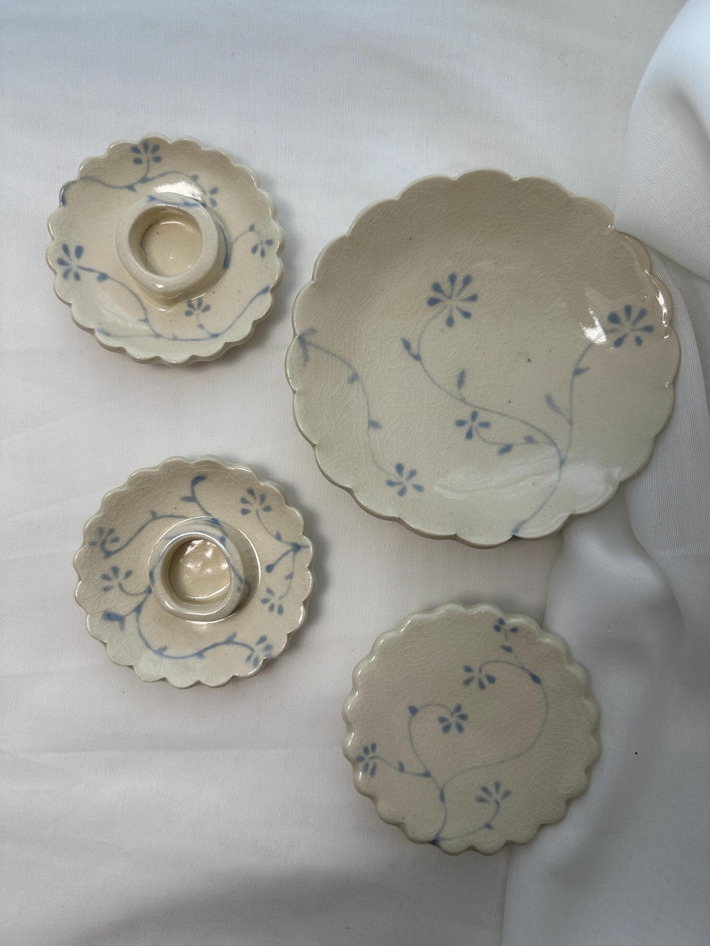 Handmade and hand painted pottery trinket dish, with handpainted blue underglaze and finished in a clear glaze, 3” with foot