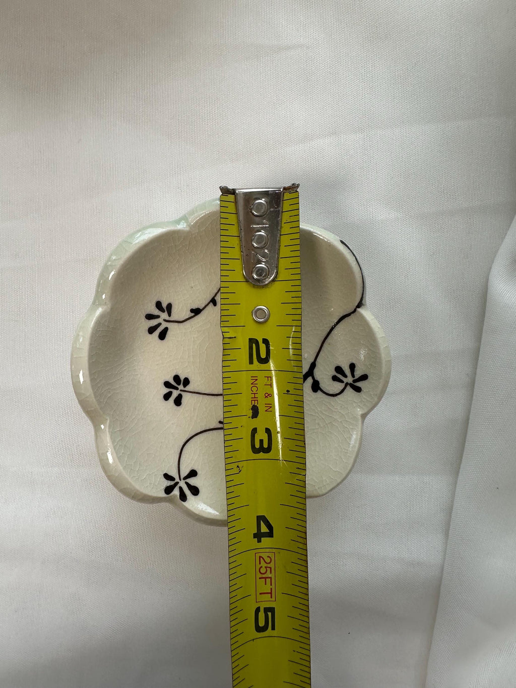 Handmade and hand painted pottery footed dish, with handpainted brown underglaze and finished in a clear glaze, 4”