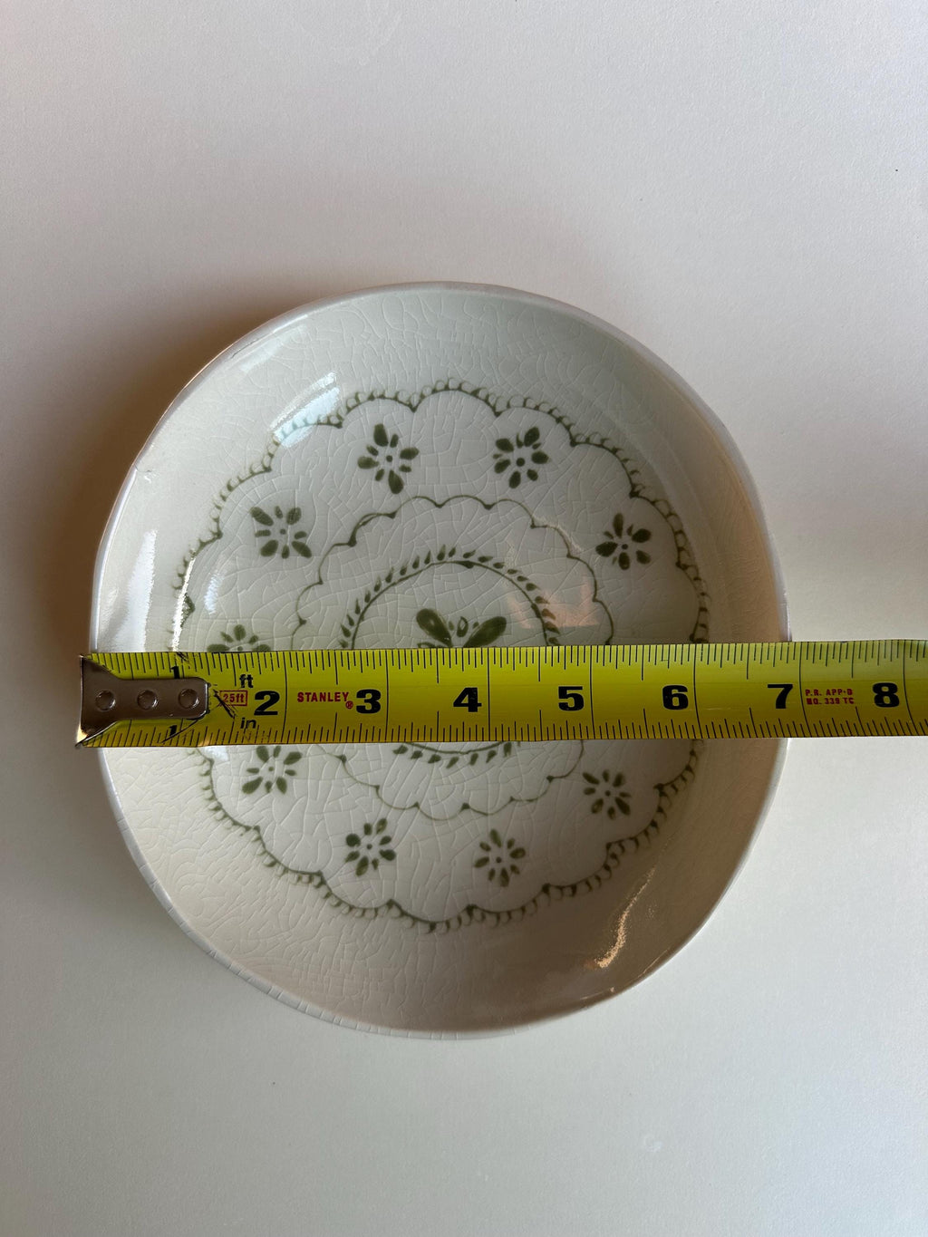Handmade and hand painted pottery bowl,  with handpainted green underglaze and finished in a clear glaze, 7”