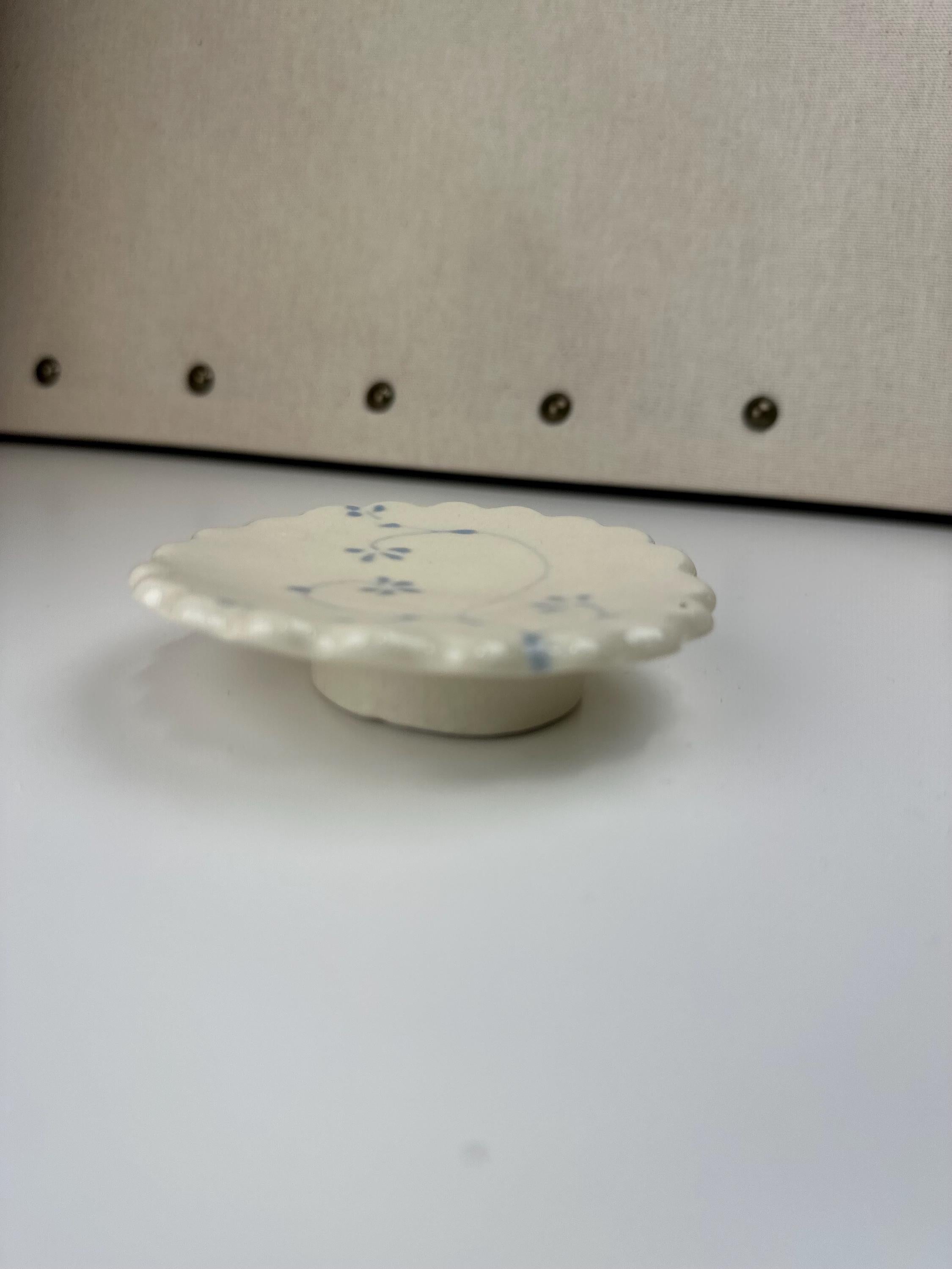Handmade and hand painted pottery trinket dish, with handpainted blue underglaze and finished in a clear glaze, 3” with foot