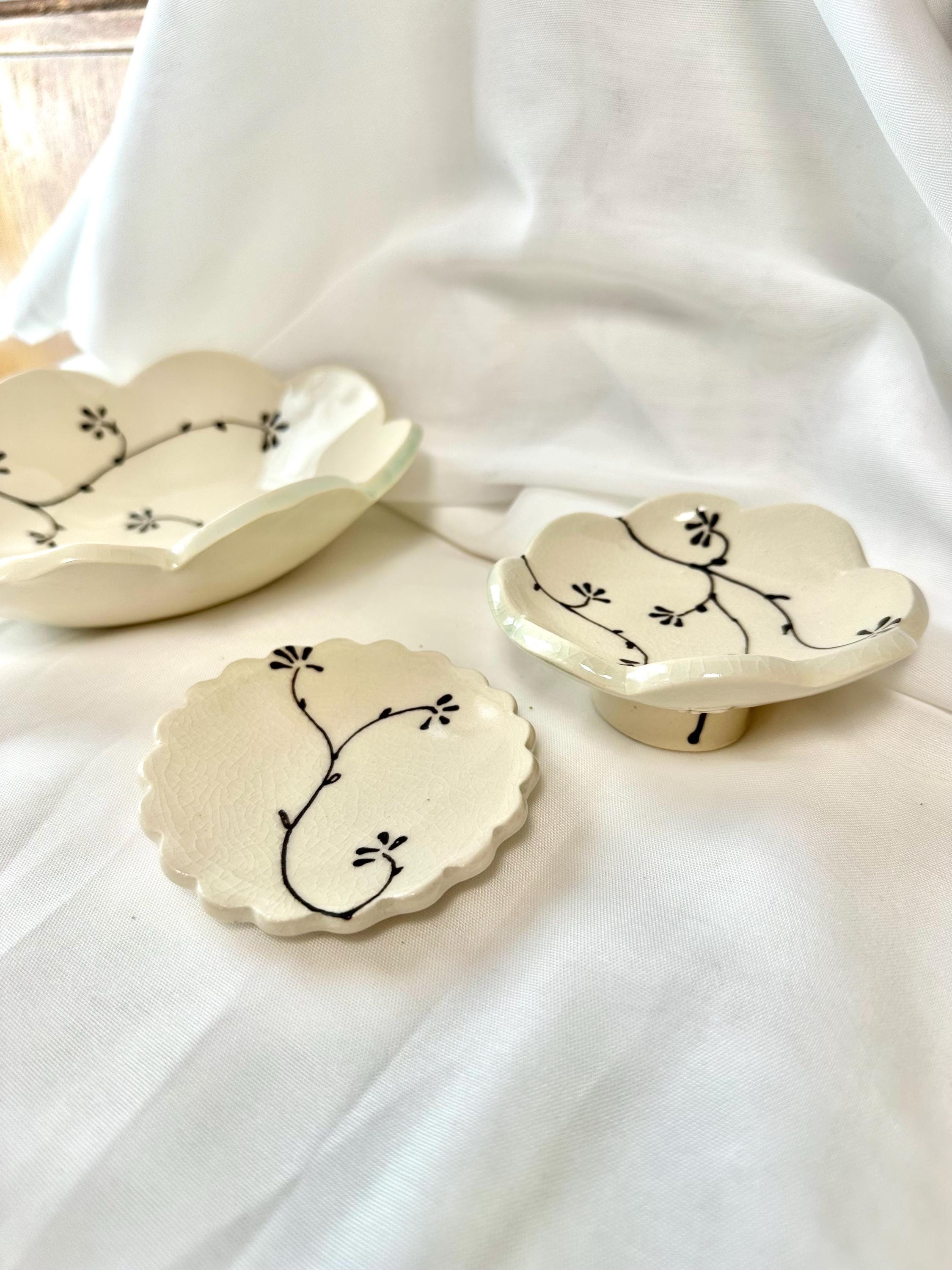 Handmade and hand painted pottery footed dish, with handpainted brown underglaze and finished in a clear glaze, 4”