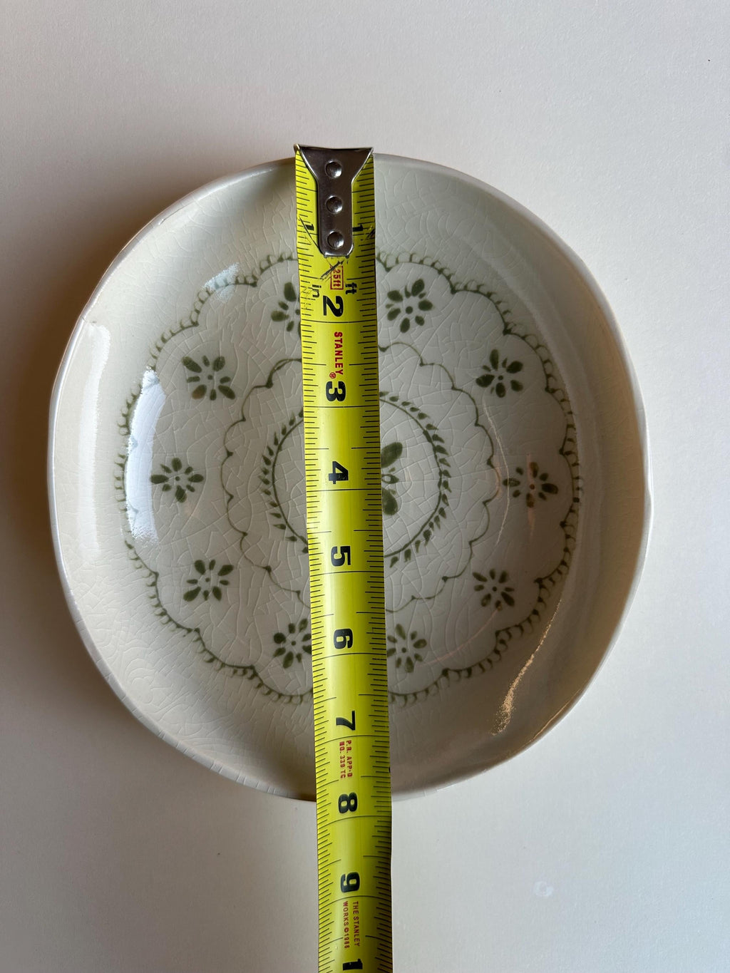 Handmade and hand painted pottery bowl,  with handpainted green underglaze and finished in a clear glaze, 7”